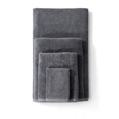 Grey plain towels shown in four sizes on a white background.